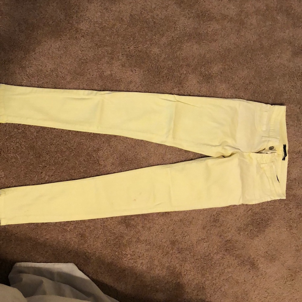 Bright pastel yellow skinny jeans